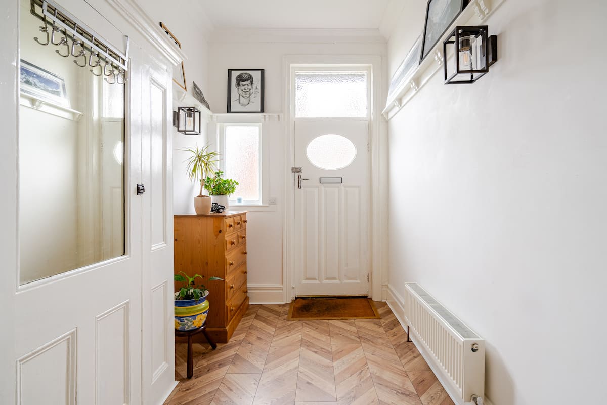 Charming hallway with herringbone floors